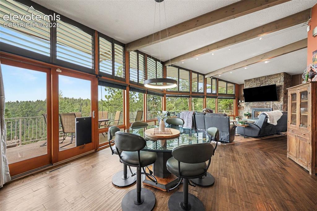 Image 13 of 30: Enjoy direct walkout access to the deck for effortless indoor-outdoor dinin