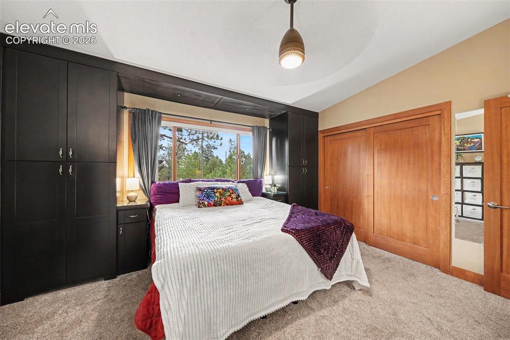 Image 15 of 30: The spacious primary suite offers a peaceful retreat with plenty of room fo