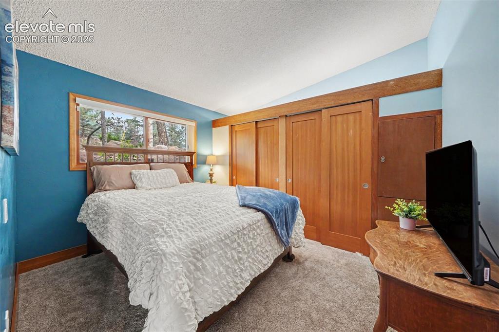 Image 18 of 30: The third bedroom is spacious and versatile, making it ideal for a guest ro