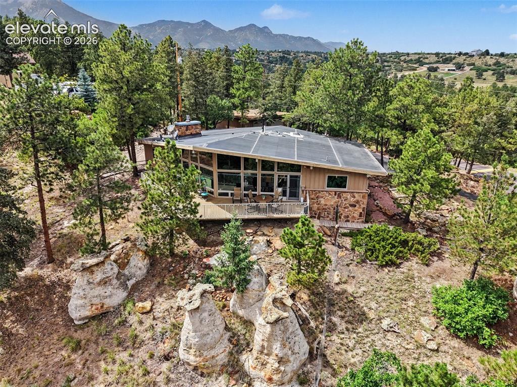 Image 24 of 30: The wooded backdrop creates a serene retreat where you can enjoy the beauty