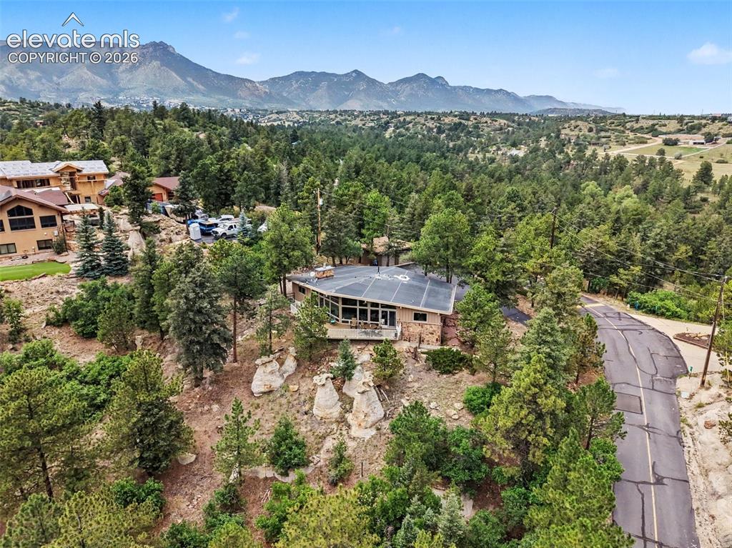 Image 26 of 30: From the towering pines to the rugged rock outcroppings, this property capt