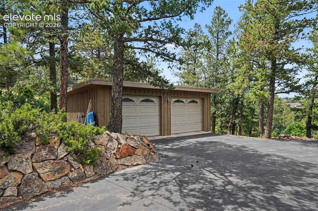 Image 6 of 30: The oversized detached 2-car garage offers exceptional storage and workspac
