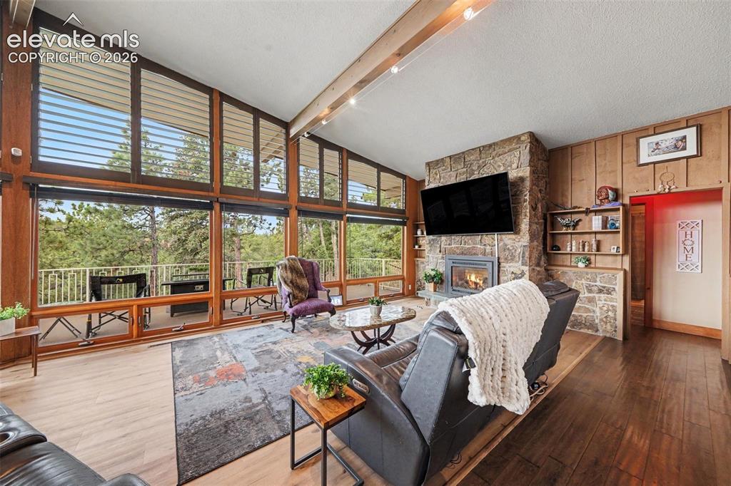 Image 8 of 30: Bright and inviting open-concept living room filled with natural light from