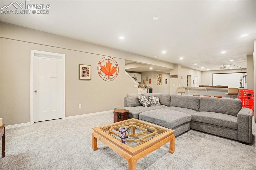 Image 20 of 35: Carpeted living area featuring recessed lighting