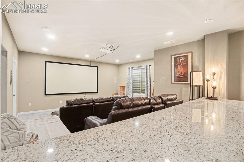 Image 21 of 35: Cinema with recessed lighting and baseboards