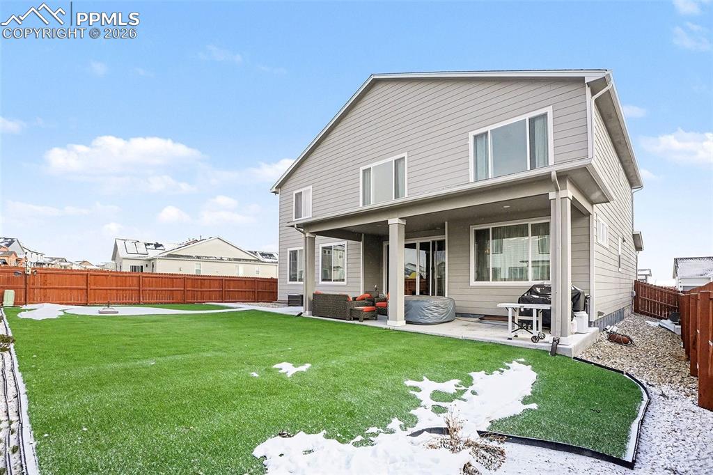 Image 27 of 35: Back of property with a patio and a fenced backyard