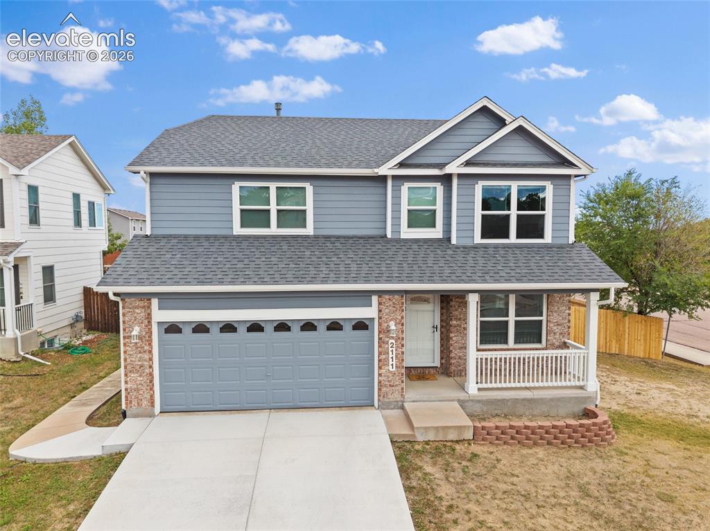 Image 30 of 41: Front aerial view of this two-story Fountain home featuring an attached two