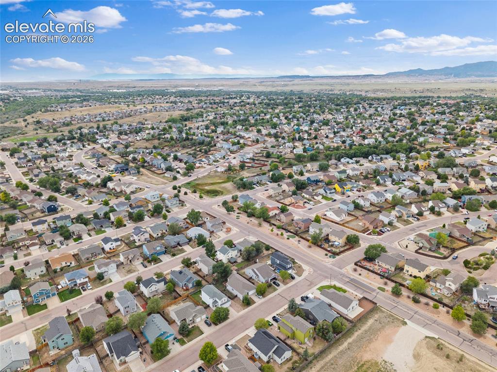 Image 34 of 41: Aerial neighborhood view showing the surrounding Fountain residential commu