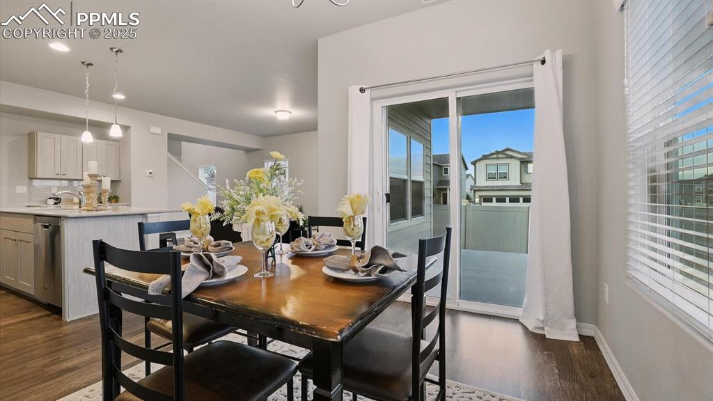 Image 13 of 47: Slider from the Dining Area to the covered backyard patio.