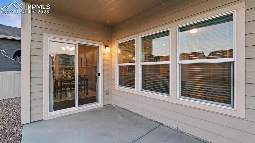 Image 15 of 47: Covered backyard patio for outdoor dining and relaxation.