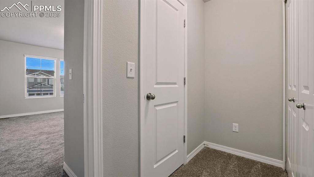 Image 26 of 47: Entry into the upper level Primary Suite.