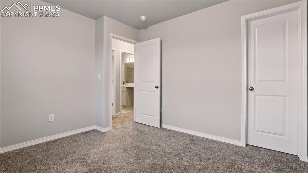 Image 33 of 47: Upper Level Bedroom #2 with walk in closet.
