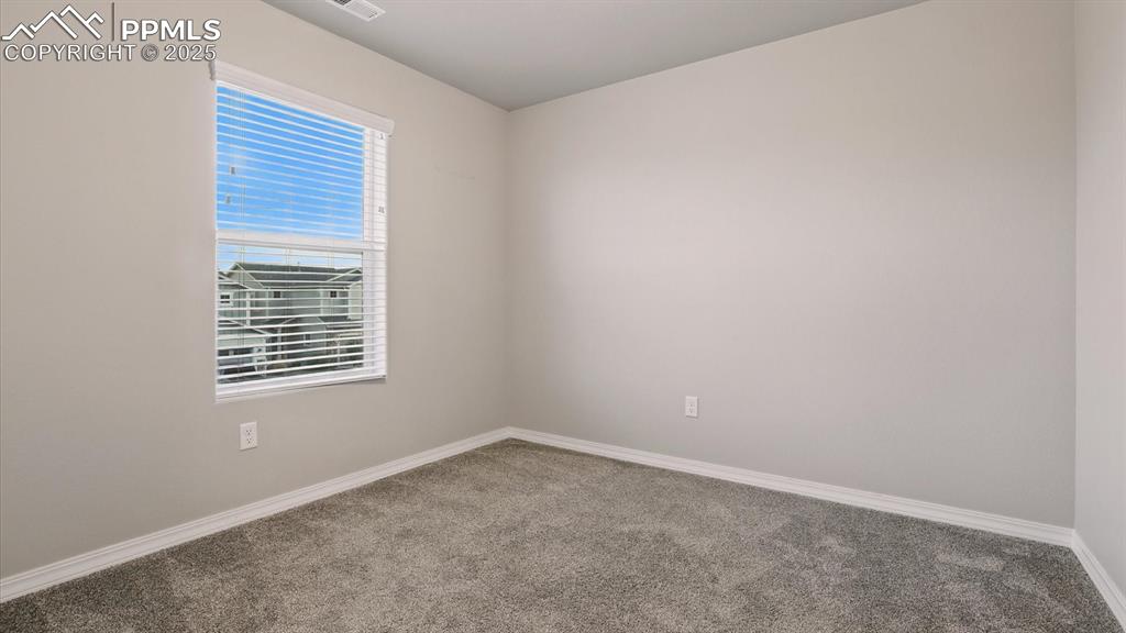 Image 34 of 47: Upper Level Bedroom #3 with neutral carpet.