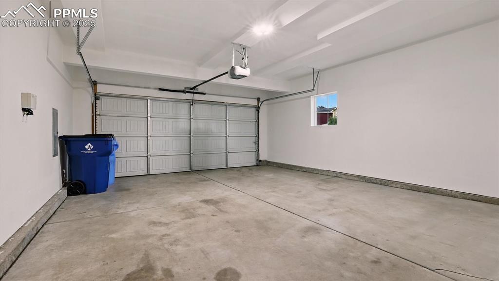 Image 37 of 47: 2-car attached garage with door opener.