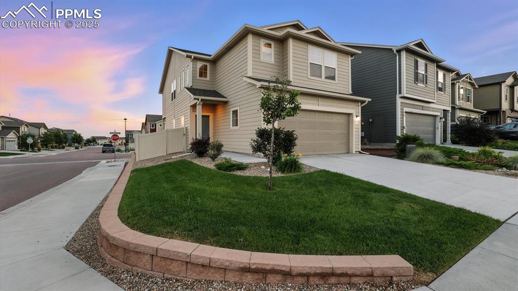 Image 4 of 47: Nicely landscaped with auto sprinklers and brick paver border.