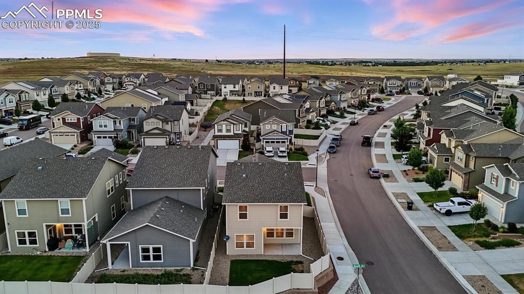 Image 43 of 47: Aerial rear view of home and corner lot.