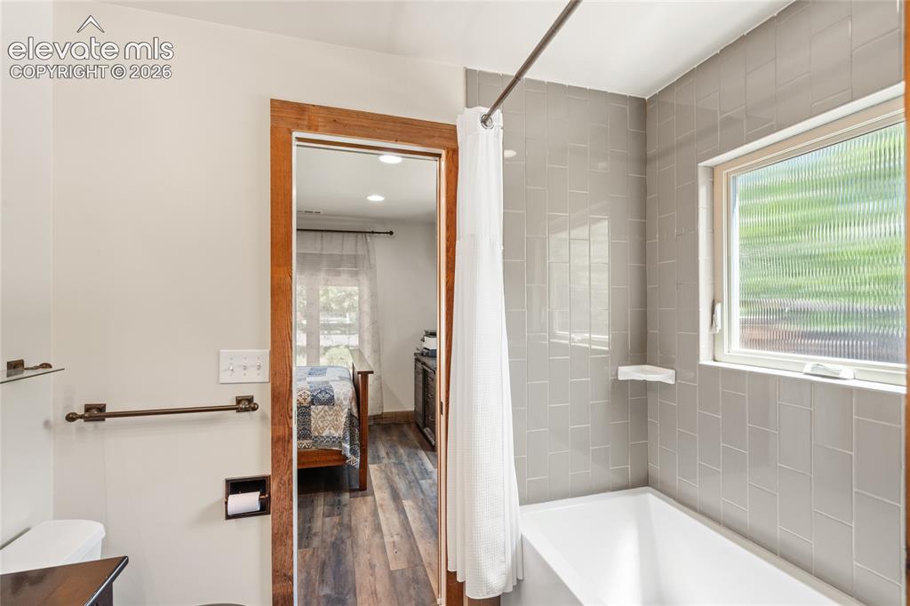 Image 20 of 38: Main house Guest Bedroom adjoins to Full Bath