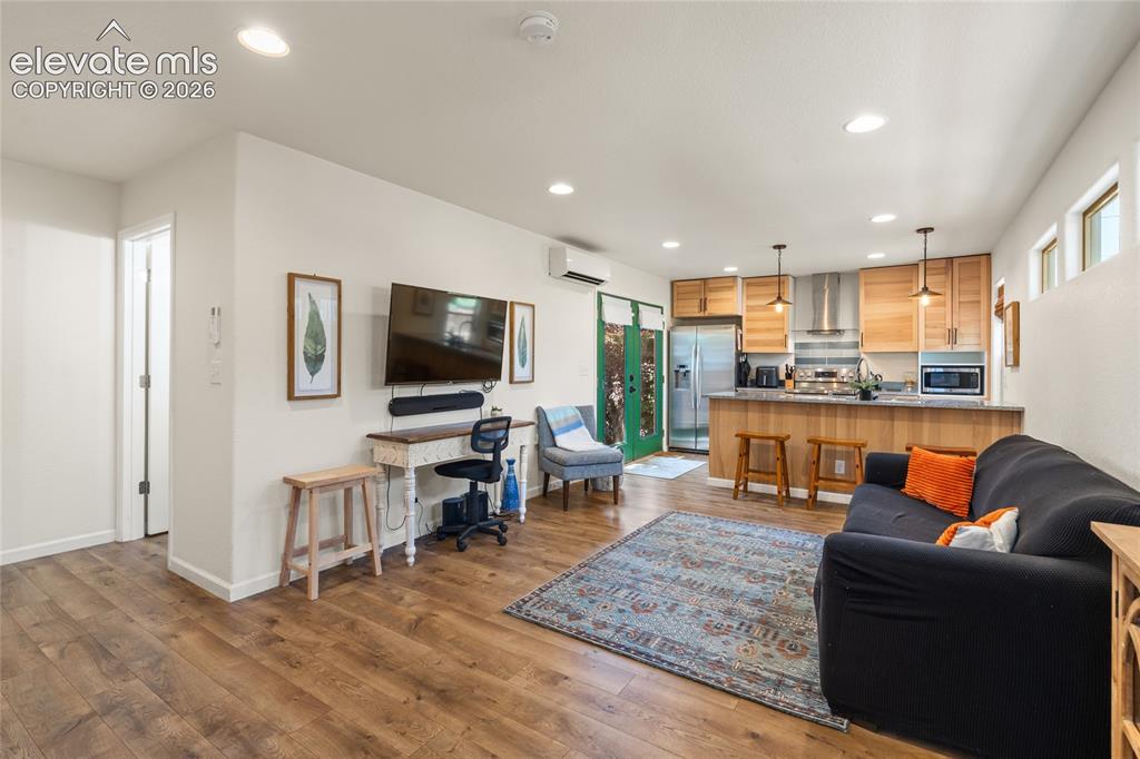 Image 22 of 38: ADU living room, view towards Kitchen and Patio doors