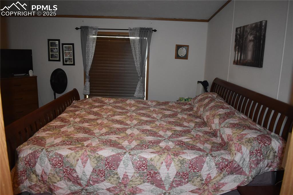 Image 18 of 47: Bedroom with ornamental molding