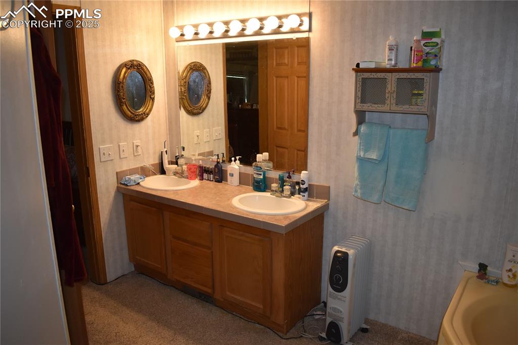 Image 22 of 47: Full bathroom with double vanity