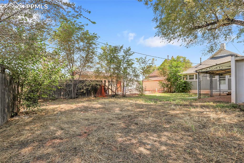 Image 28 of 29: View of fenced backyard