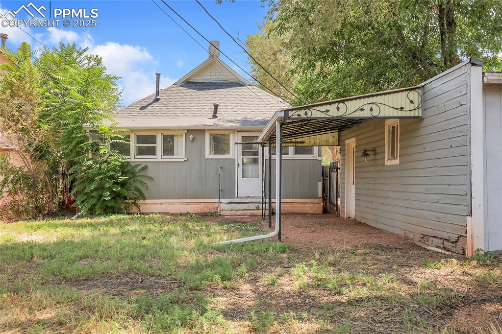 Image 29 of 29: Rear view of property with roof with shingles and entry steps