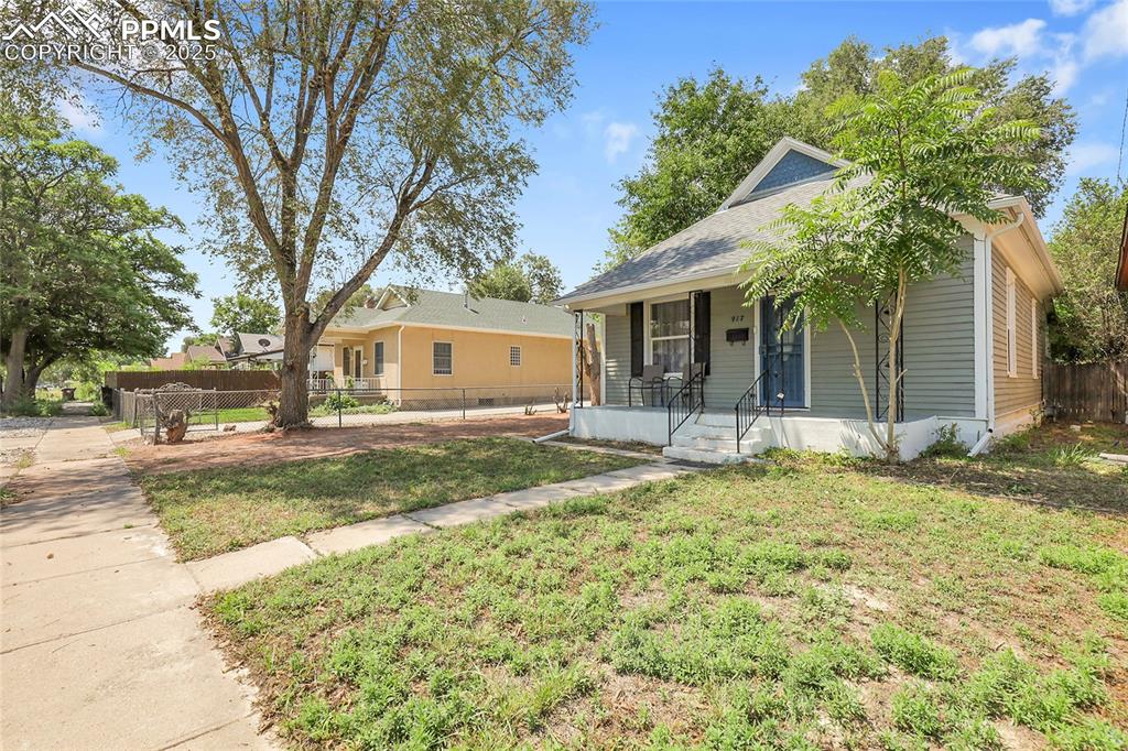 Image 3 of 29: Bungalow-style house with covered porch and roof with shingles