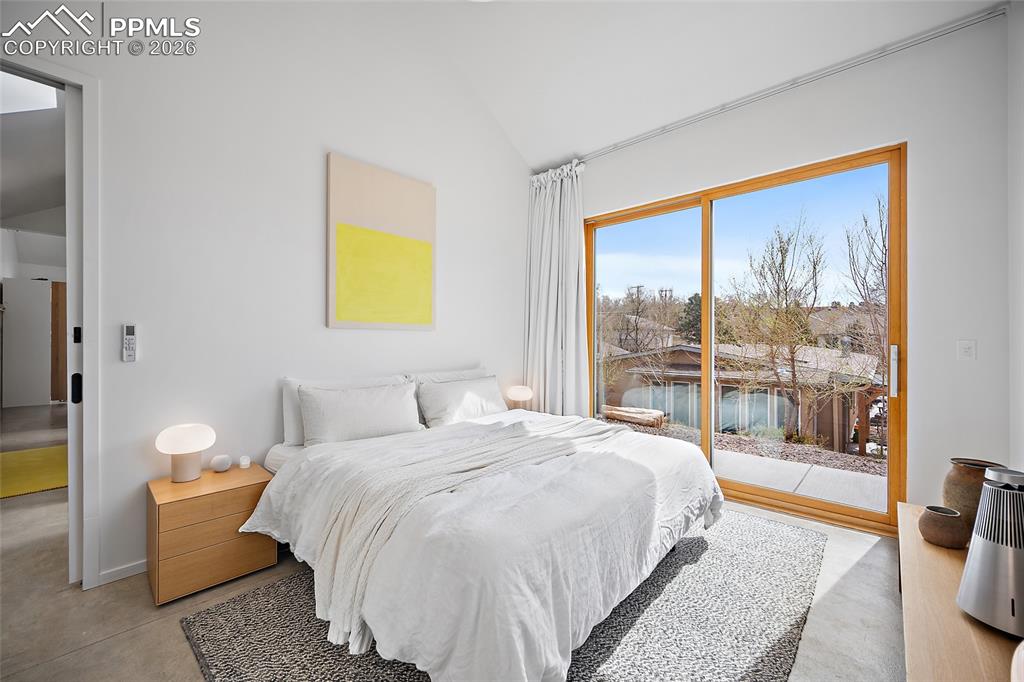 Image 22 of 50: Huge island with breakfast bar. Skylight adding natural lighting.