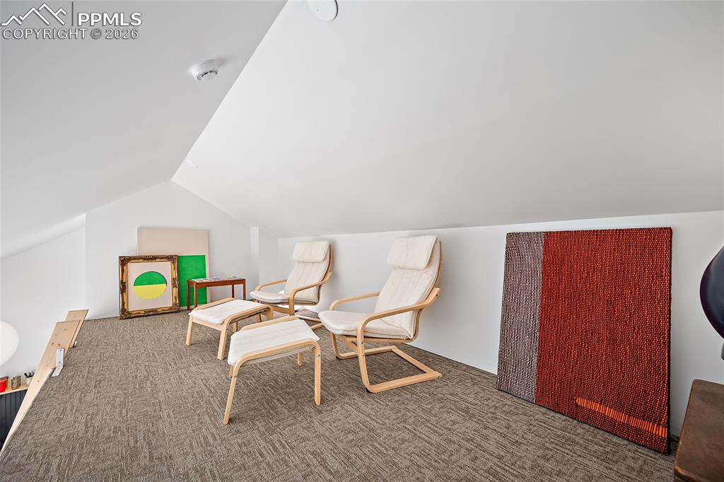 Image 46 of 50: Large Guest house bedroom with sliding glass doors.