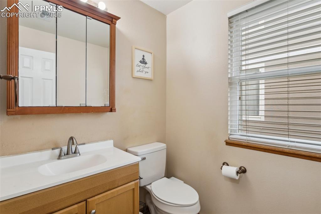Image 19 of 35: Bathroom featuring visible vents, toilet, and vanity