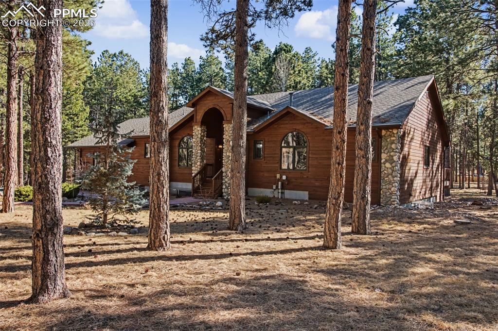 Image 4 of 50: View of front of home featuring roof with shingles