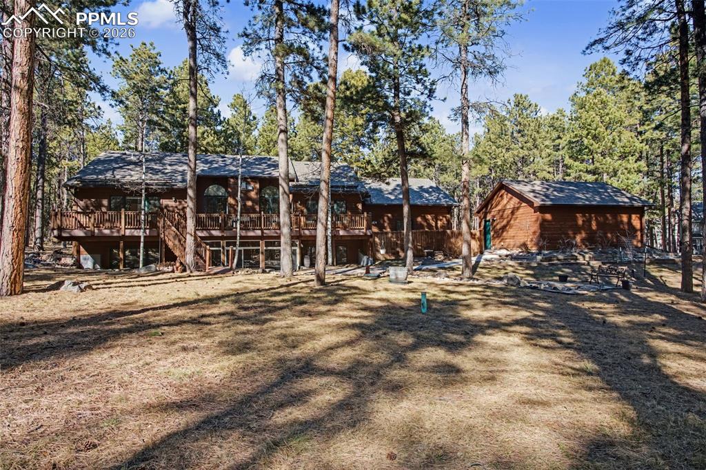 Image 45 of 50: View of front of property with a deck and stairway