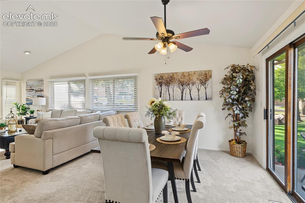 Image 10 of 27: Vaulted ceilings with a ceiling fan, wall-to-wall carpeting, multiple windo