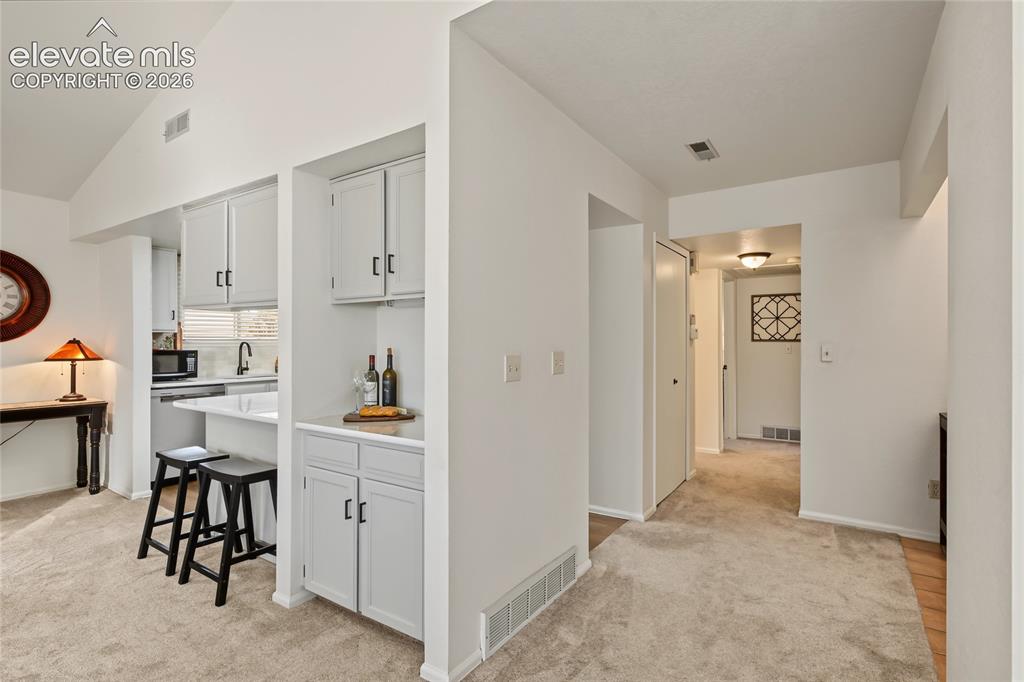 Image 14 of 27: Vaulted ceiling with recessed lighting