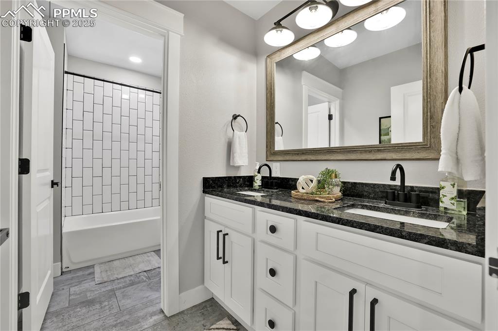 Image 31 of 36: Full bathroom double sinks, granite
