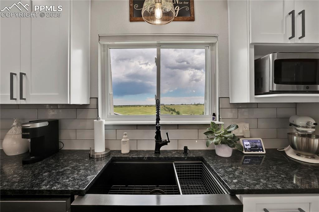 Image 8 of 36: Views from every window in this home! Granite and modern finishes