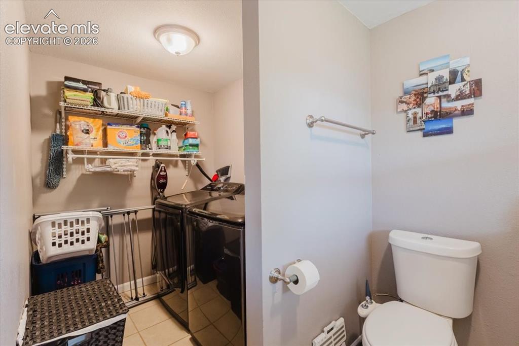 Image 20 of 49: Laundry and half bath
