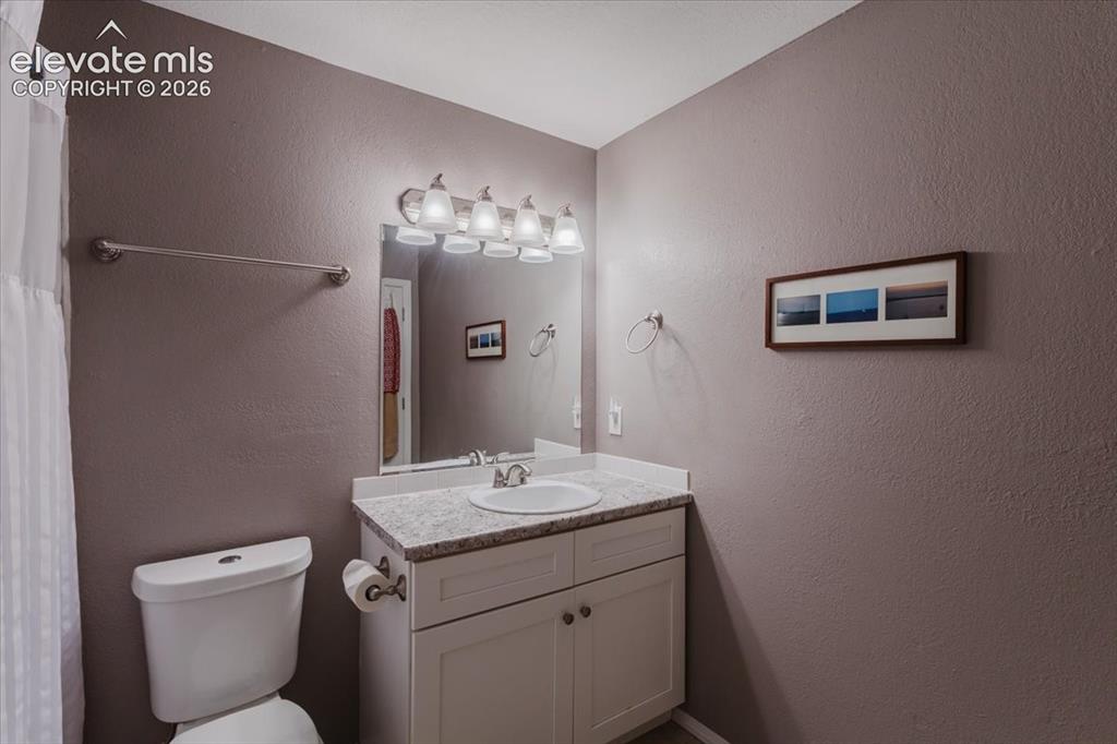 Image 31 of 49: Upstairs hall bathroom