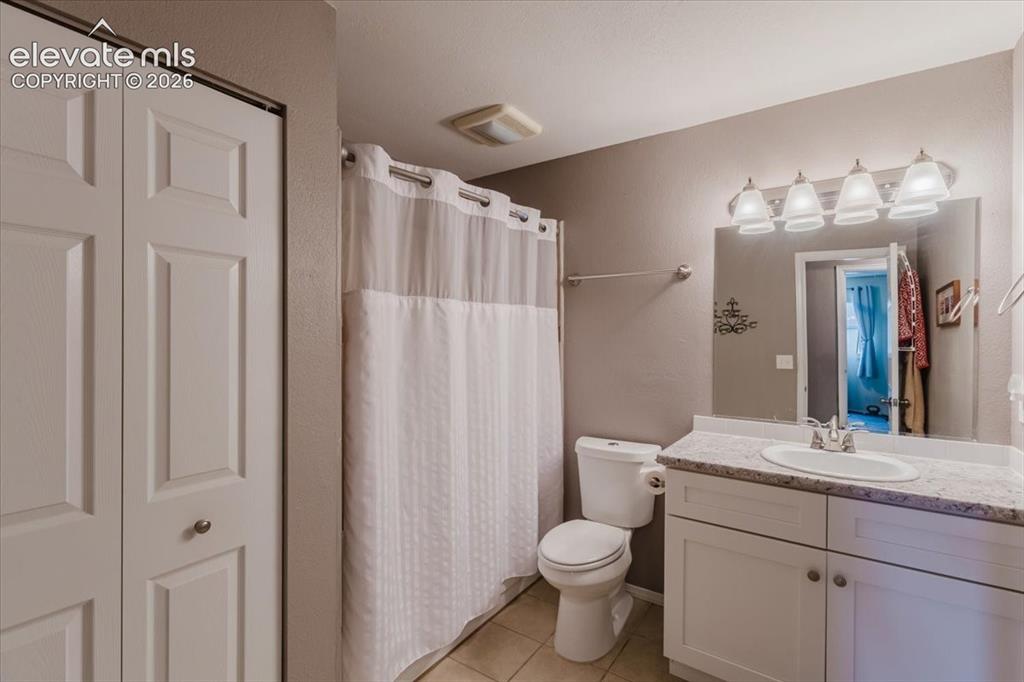 Image 32 of 49: Upstairs hall bathroom