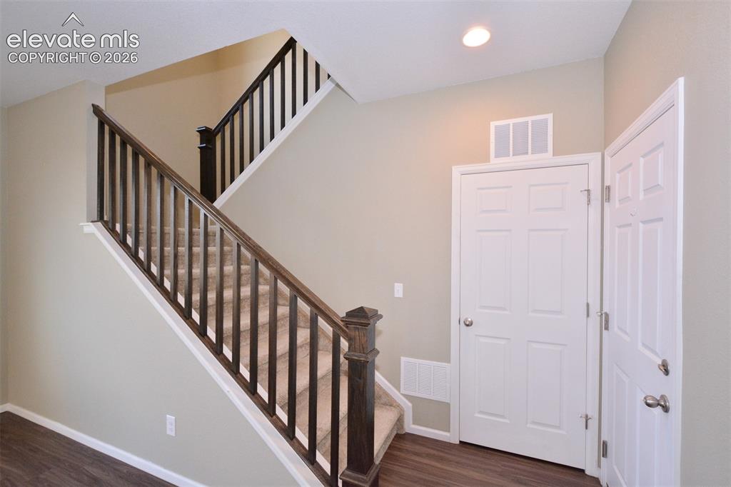 Image 10 of 20: Stairs to the Upper level