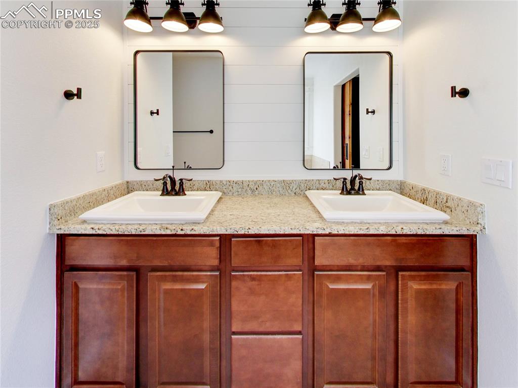 Image 21 of 37: Full bathroom with double vanity