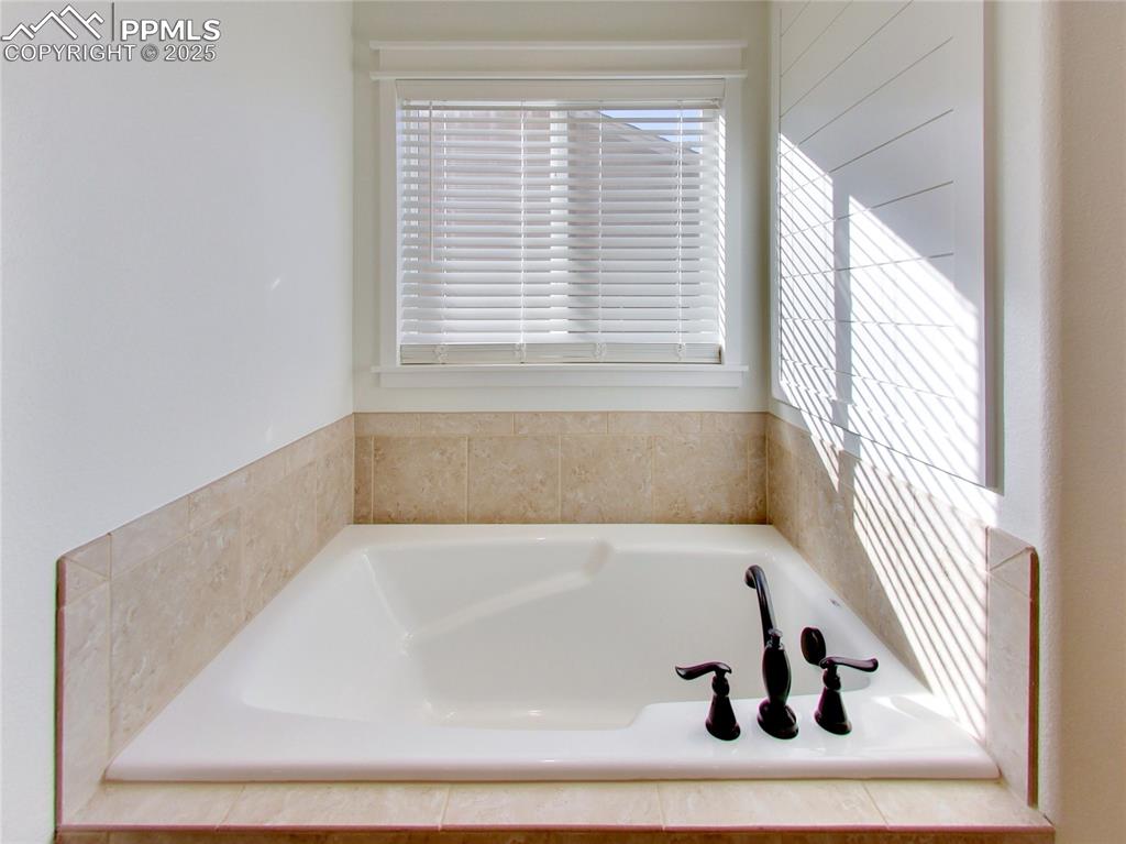 Image 22 of 37: Full bathroom featuring a garden tub