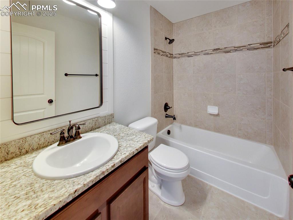 Image 26 of 37: Full bathroom featuring bathtub / shower combination and vanity
