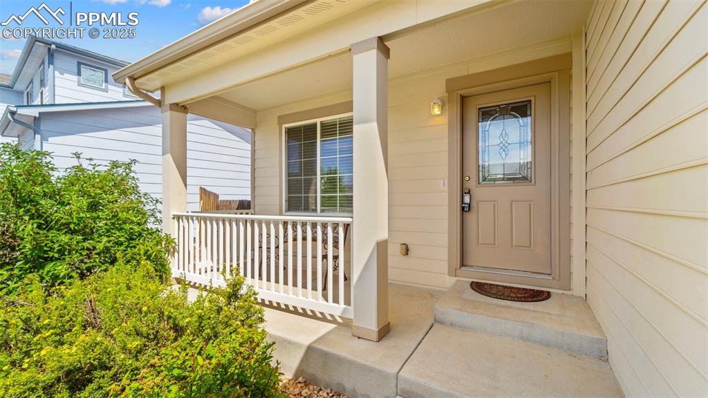 Image 3 of 46: Entrance to property with a porch