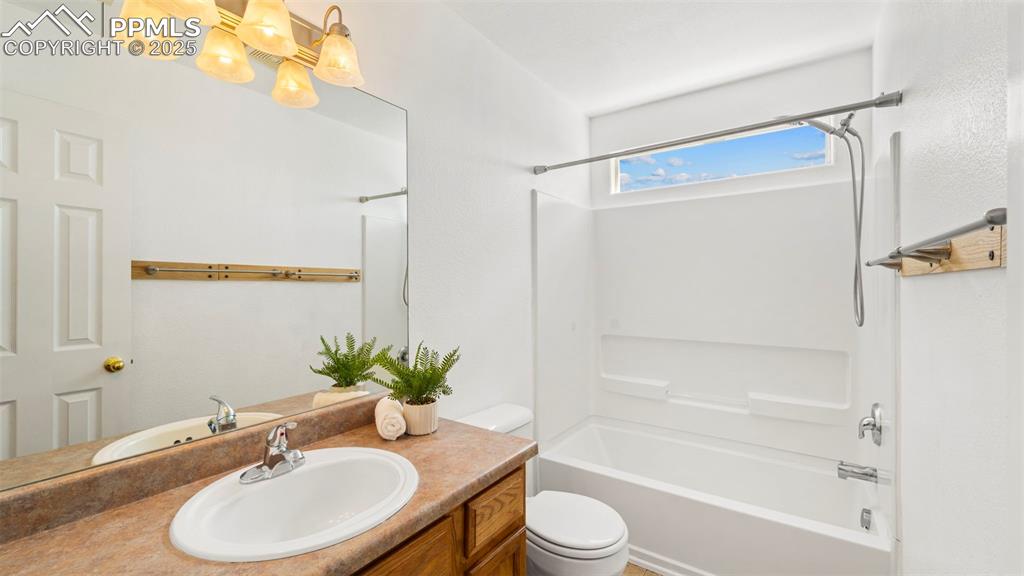 Image 30 of 46: Full bath with shower / washtub combination and vanity