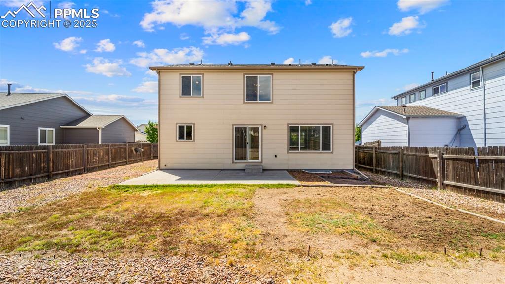 Image 35 of 46: Back of house featuring a patio area and a fenced backyard