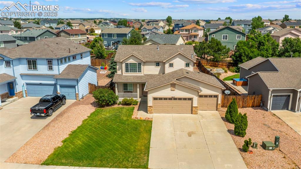 Image 44 of 46: View of front of home featuring driveway, a residential view, a shingled ro