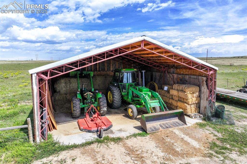 Image 34 of 49: View of pole building with a view of rural / pastoral area