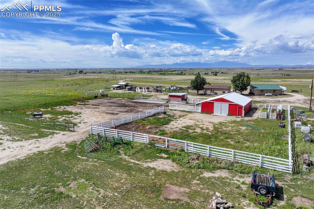 Image 39 of 49: Overview of rural landscape with a mountainous background