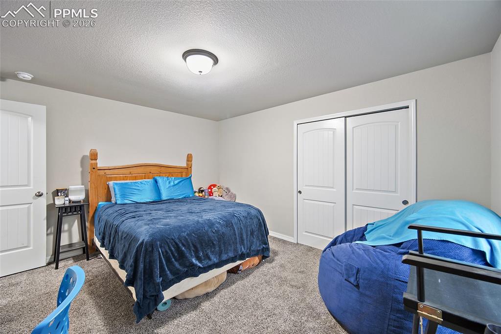 Image 24 of 28: Basement Bedroom
